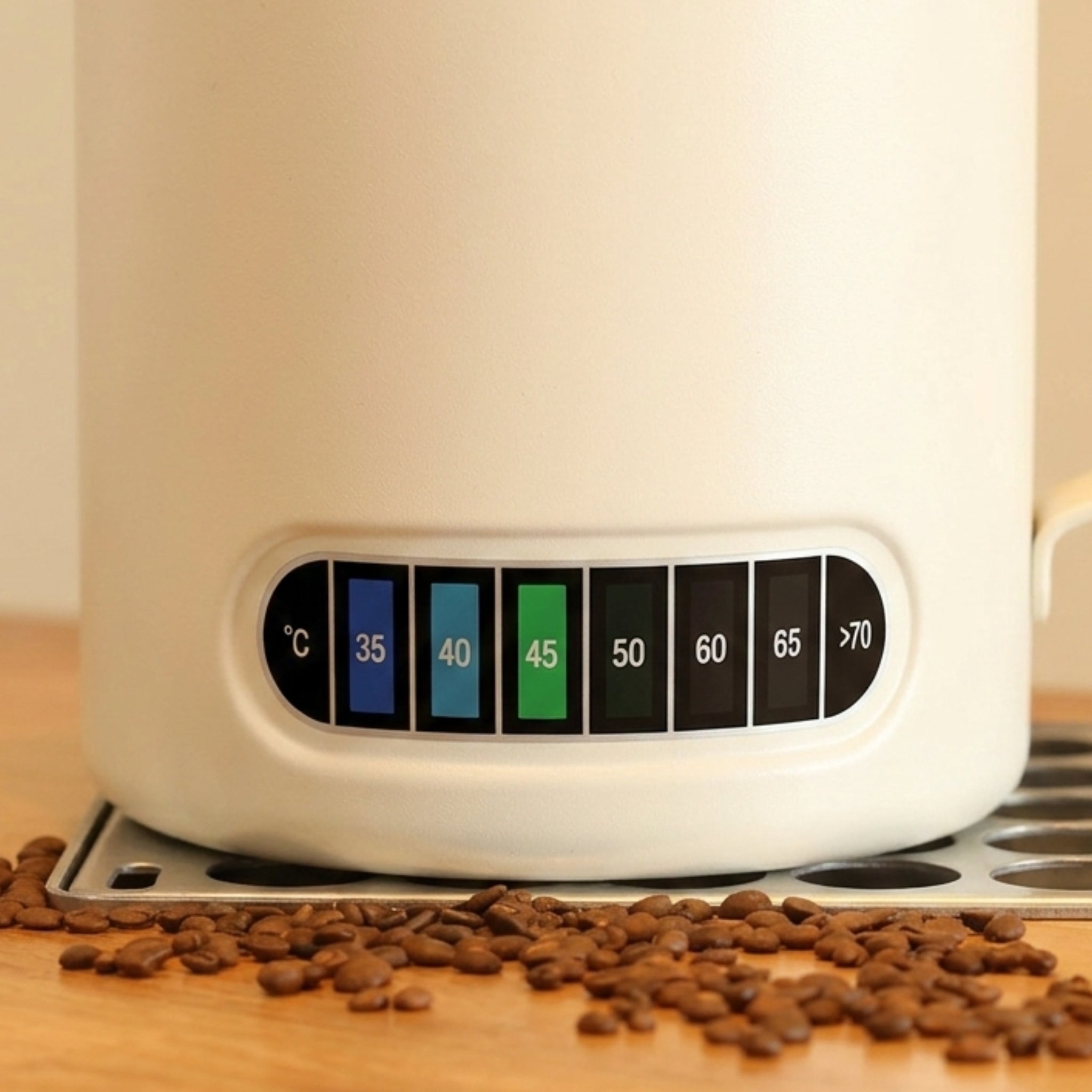 Thermosense milk jug with built-in thermometer in beige, showing temperature indicator at 45°C