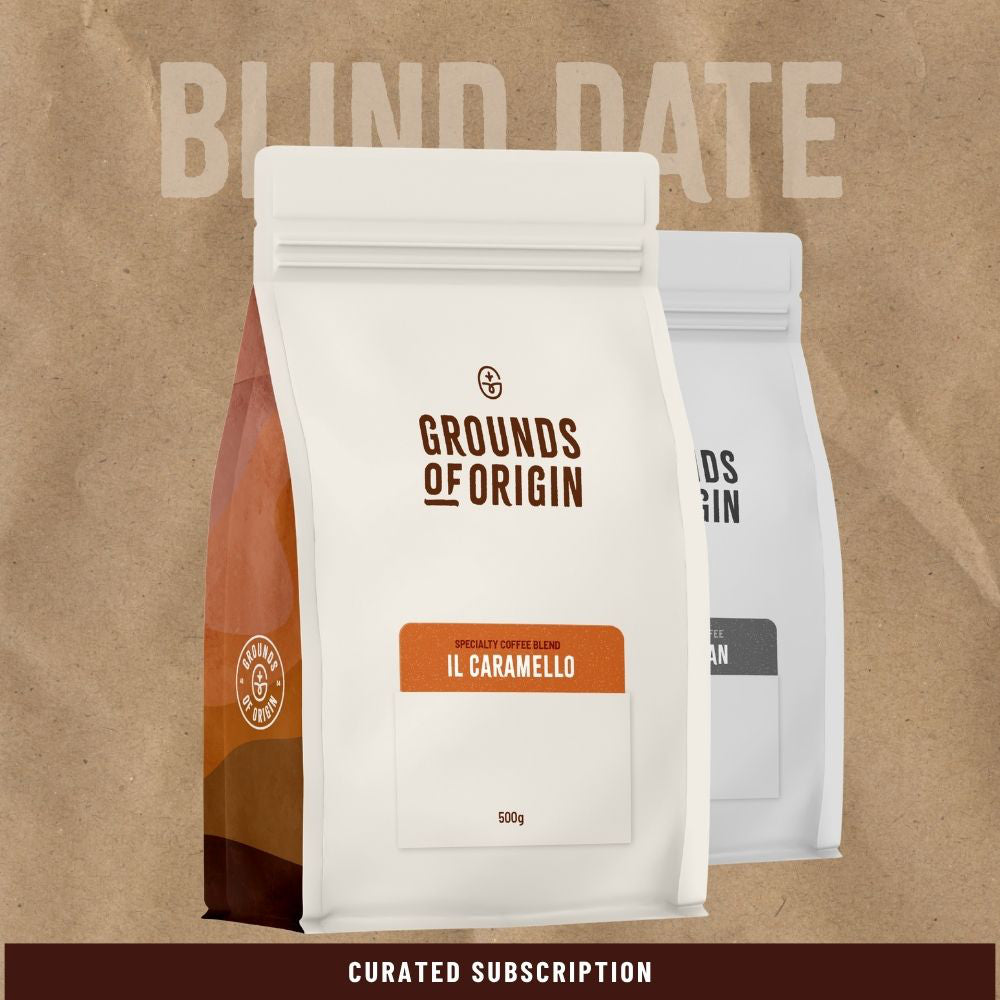 Coffee package labeled 'Grounds of Origin' on a brown background with text 'Blind Date'.