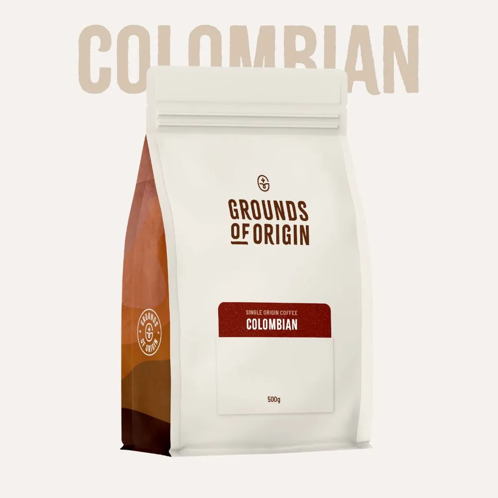Coffee bag labeled 'Grounds of Origin' with 'Colombian' text on a white background