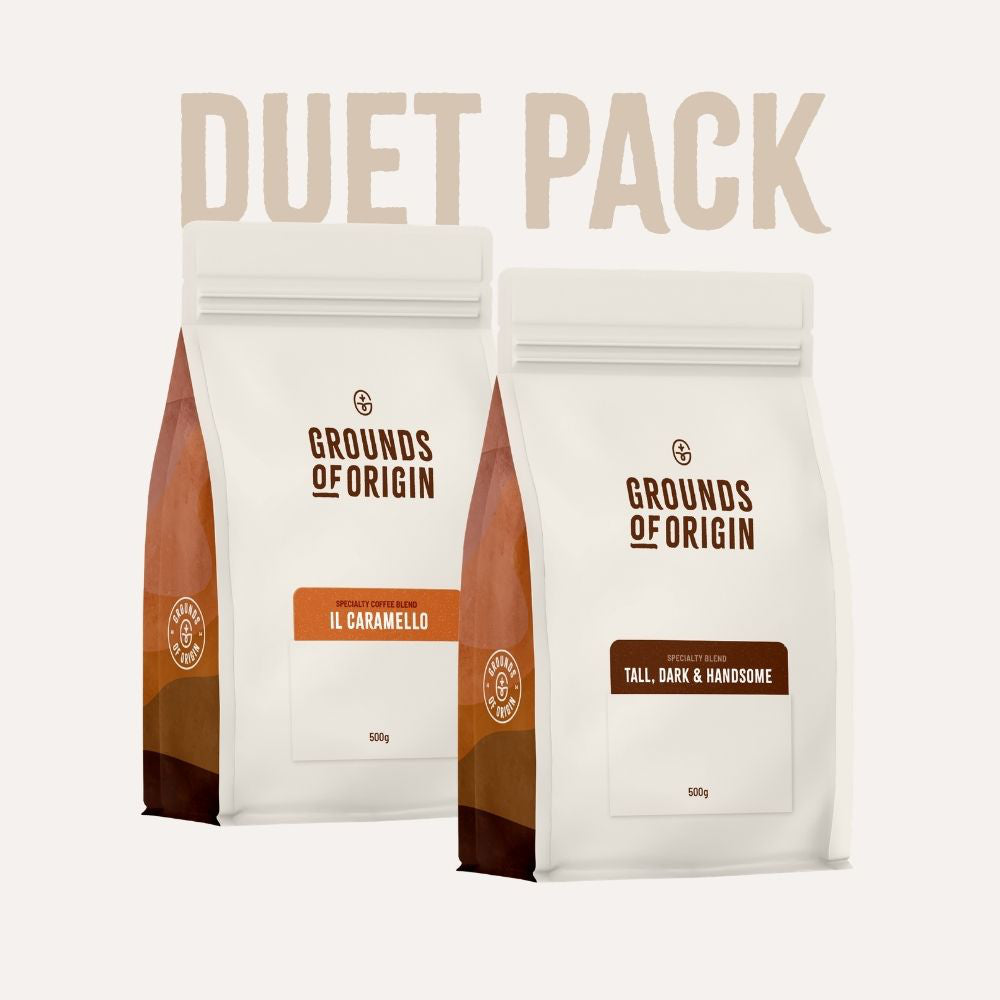 Two coffee bags from 'Grounds of Origin' with 'Duet Pack' text on a white background