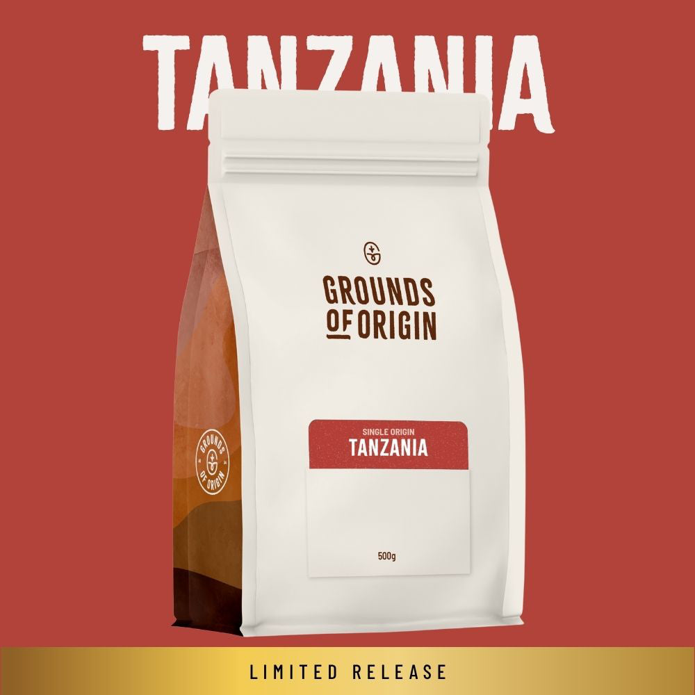 A 500g bag of Grounds of Origin Tanzania coffee on a solid red background with a gold banner at the bottom reading 'LIMITED RELEASE'.